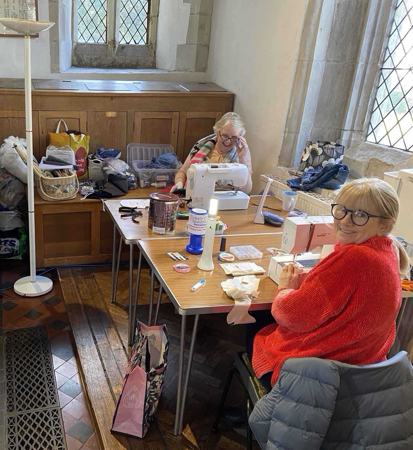 The sewing team at their machines in the church
