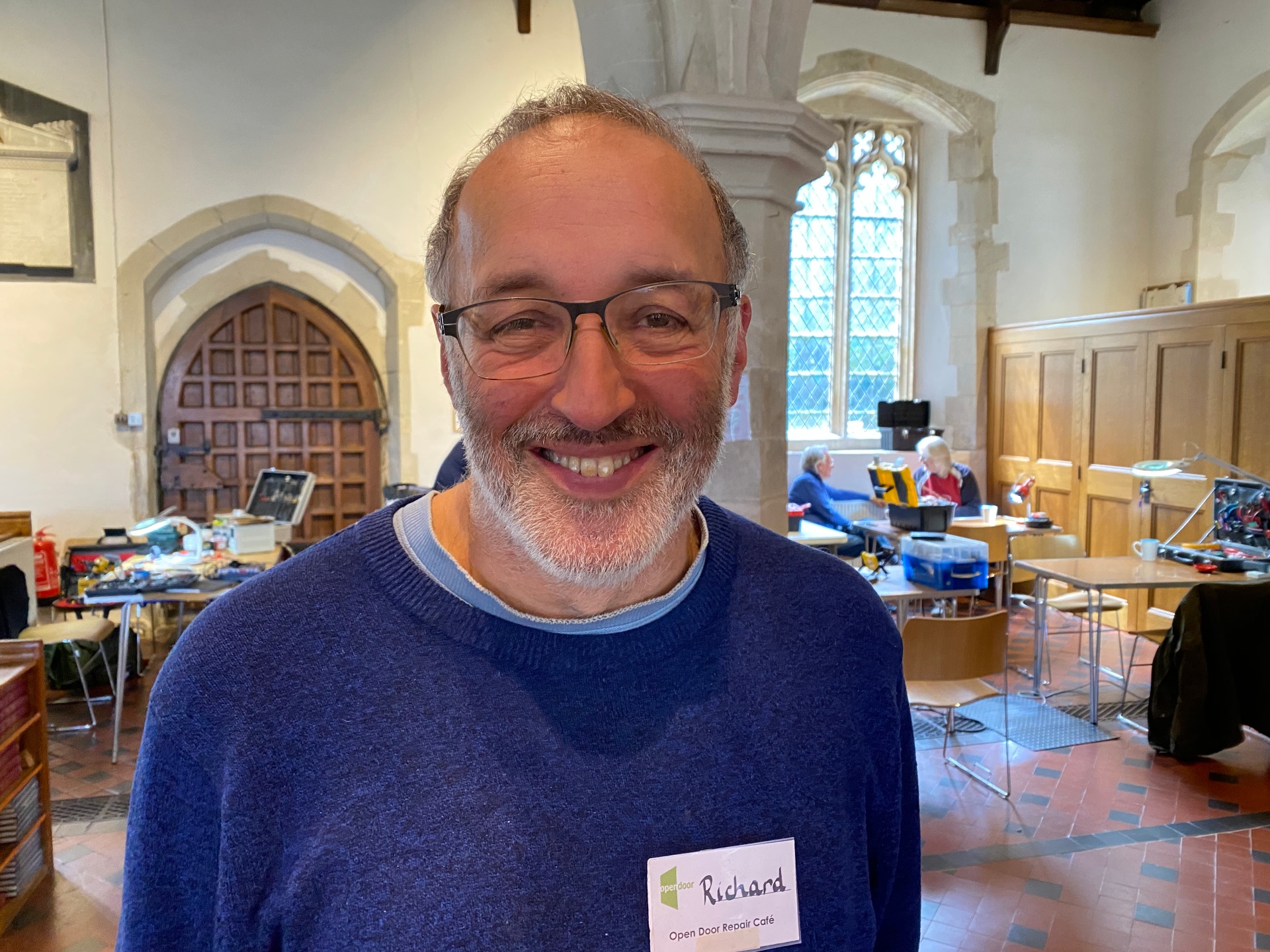 Richard, volunteer fixing electronics and bikes at the Repair Cafe